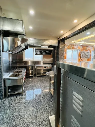 In-house kitchen at Swastik Boys Hostel